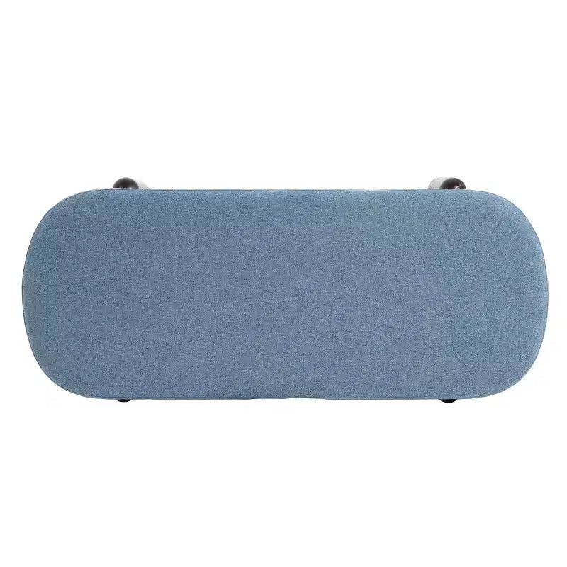 Ottoman de rangement ovale moderne en tissu Leroy avec pieds en bois massif