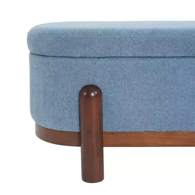 Ottoman de rangement ovale moderne en tissu Leroy avec pieds en bois massif
