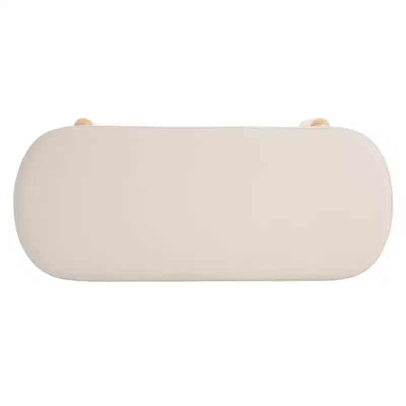 Ottoman de rangement ovale moderne en tissu Leroy avec pieds en bois massif