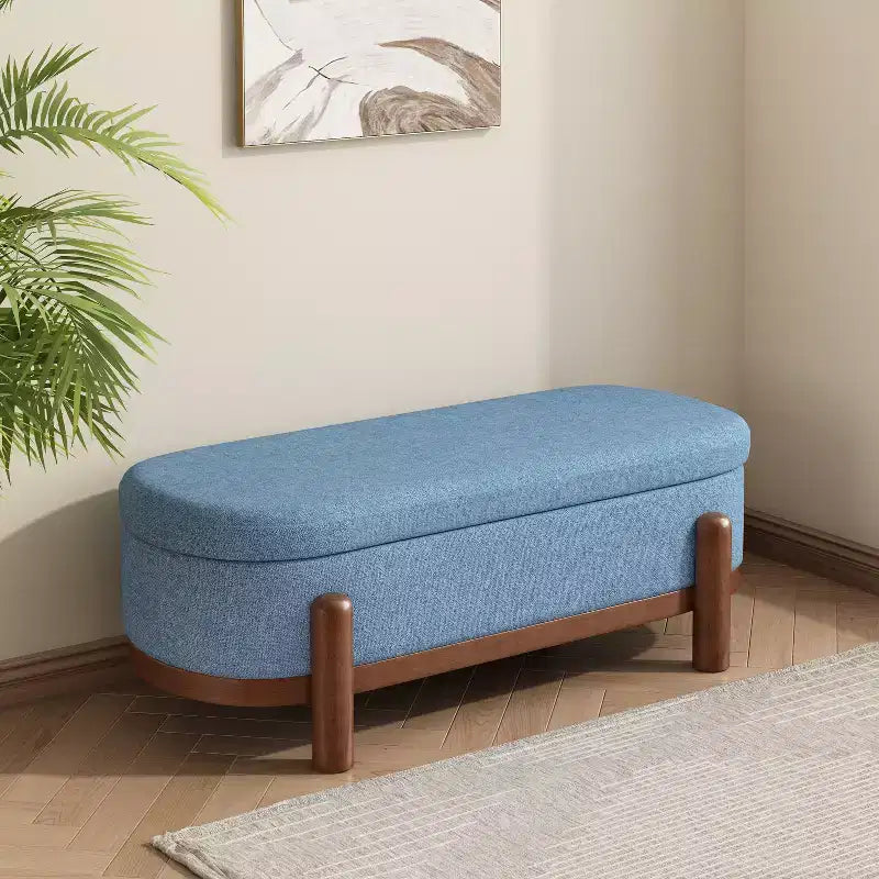 Ottoman de rangement ovale moderne en tissu Leroy avec pieds en bois massif